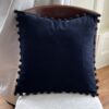 black velvet pompom cushion