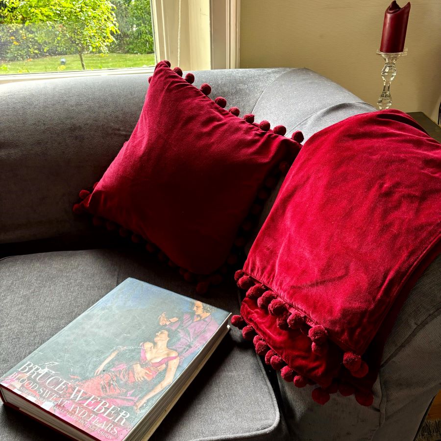 red velvet pompom cushion
