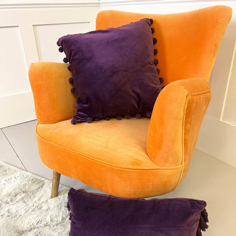 aubergine velvet pompom cushion