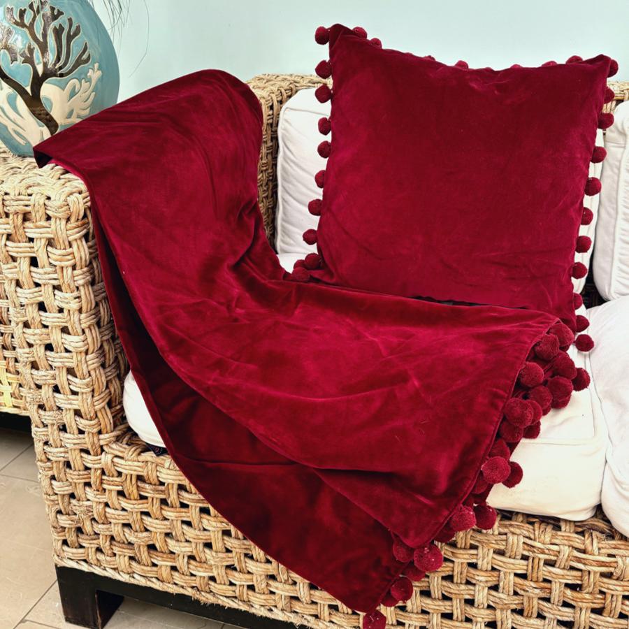 red velvet pompom cushion