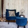 petrol blue armchair and stool