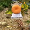 orange round showerproof cushion