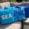 turquoise showerproof garden cushion