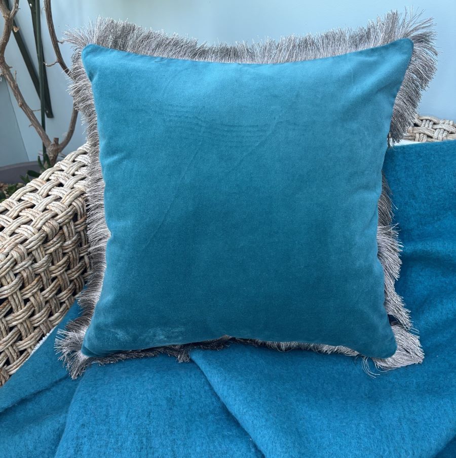 teal velvet fringe cushion